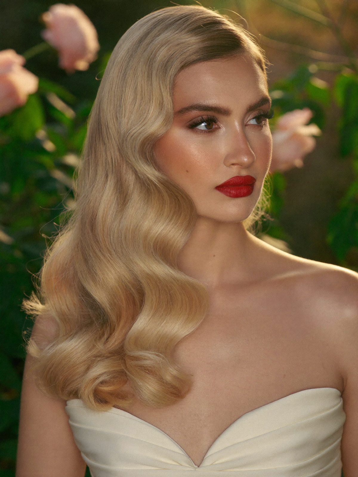 Soft Hollywood waves and a warm satin red lip on a bride, Ania Glam Lab